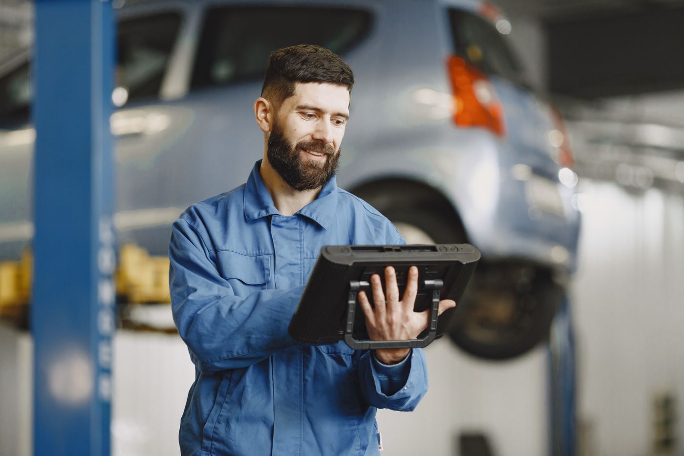 Mechanic checking a car engine